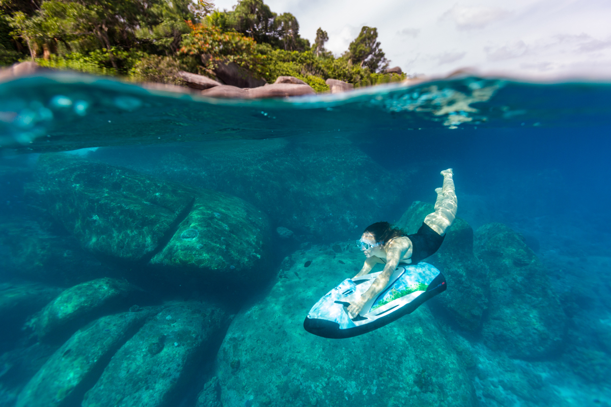 Woman using underwater jetski